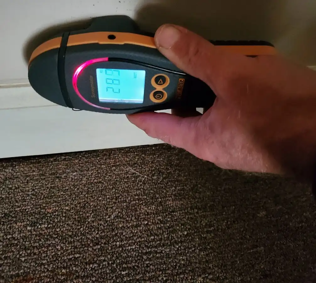 Moisture detection at baseboard during Storm Damage Restoration in Stokesdale